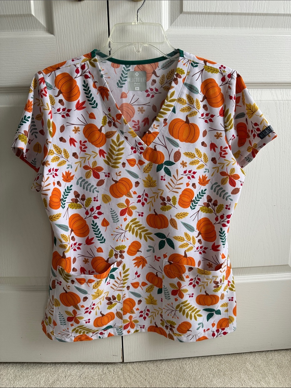 Med Couture Women's Pumpkin Print V-Neck Scrub Top - Orange, Green, Yellow, Red